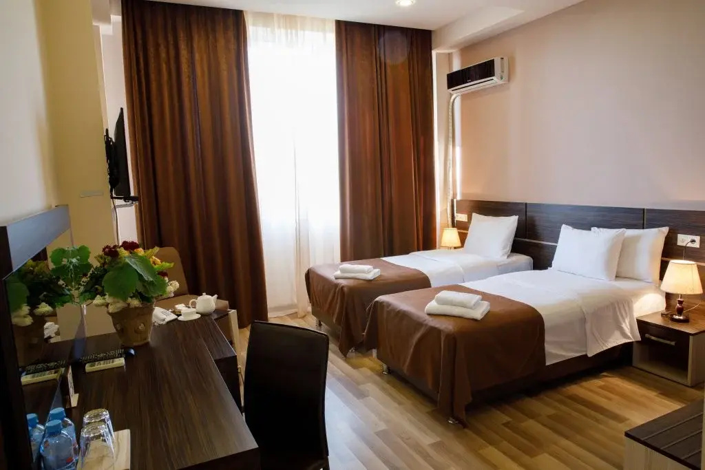 Family room with garden greenery at Hotel Olympia Garden